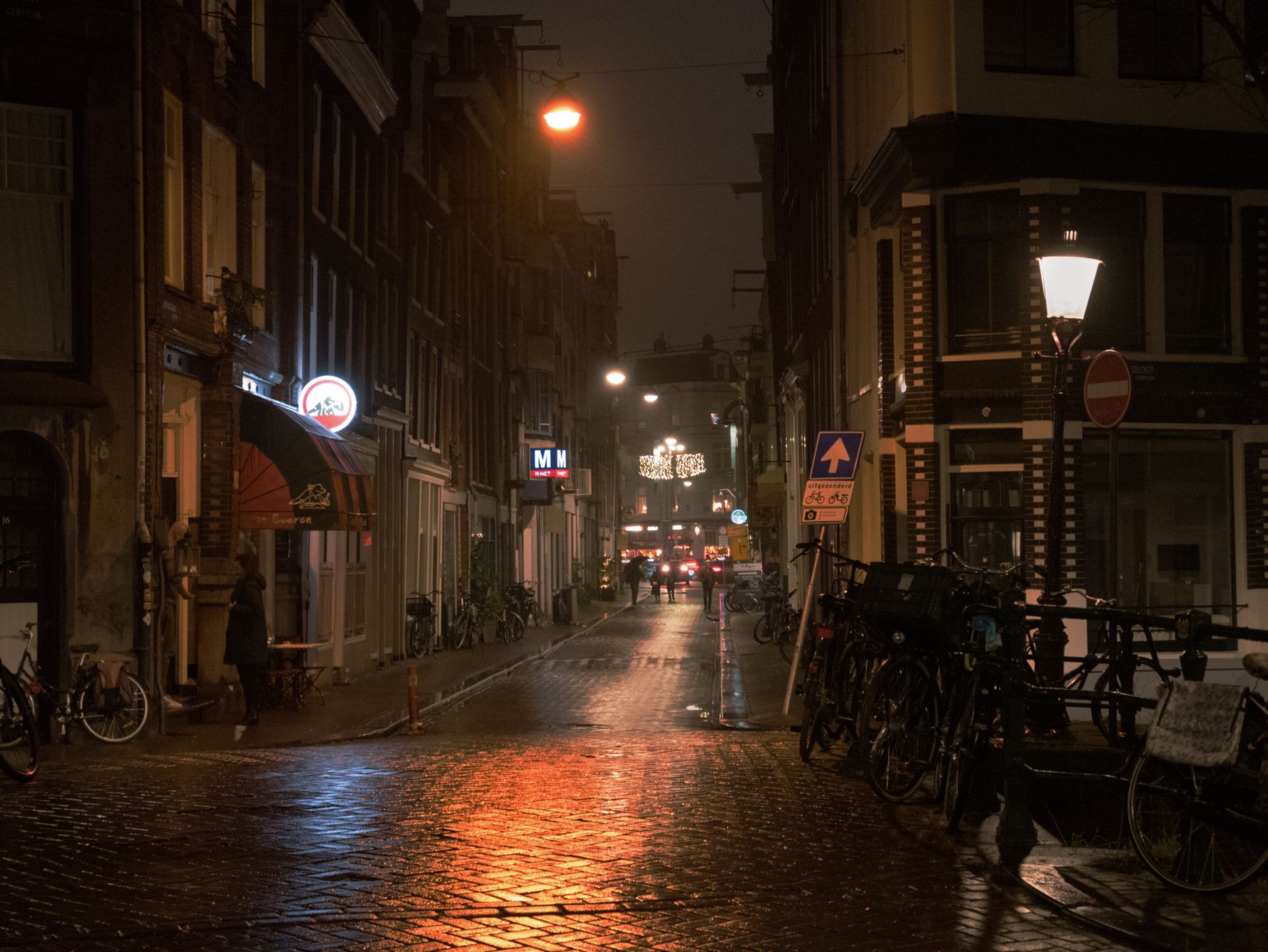 Warmoesstraat Amsterdam gay leather bar strip night street neon cobblestones