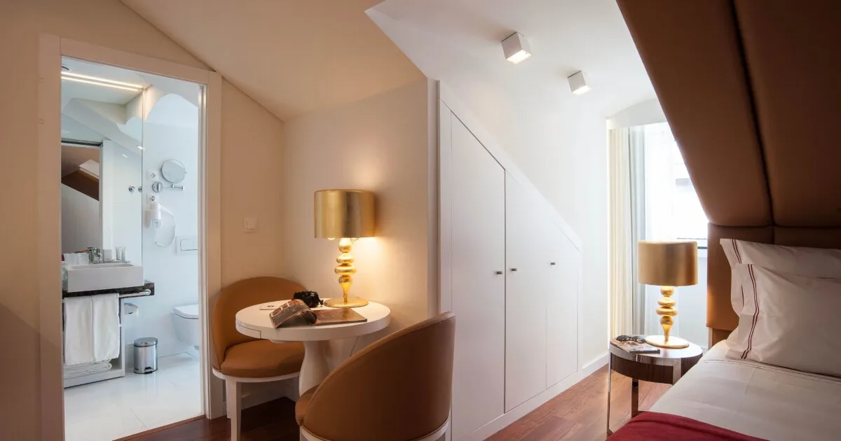 Stylish hotel room interior in Lisbon with modern furniture and warm lighting, gay hotels Lisbon