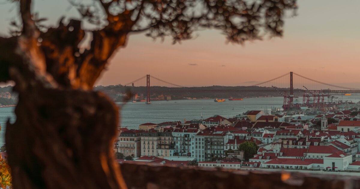 Sunset over Lisbon with the 25 de Abril Bridge — the gay Lisbon travel guide 2026