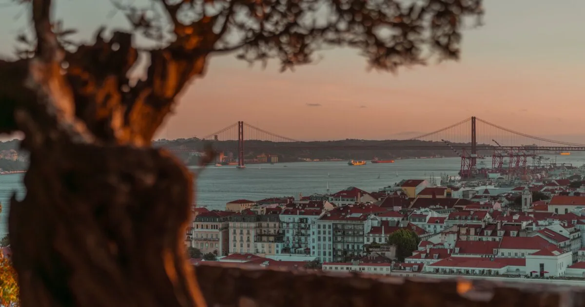 Sunset over Lisbon with the 25 de Abril Bridge, the gay Lisbon travel guide 2026