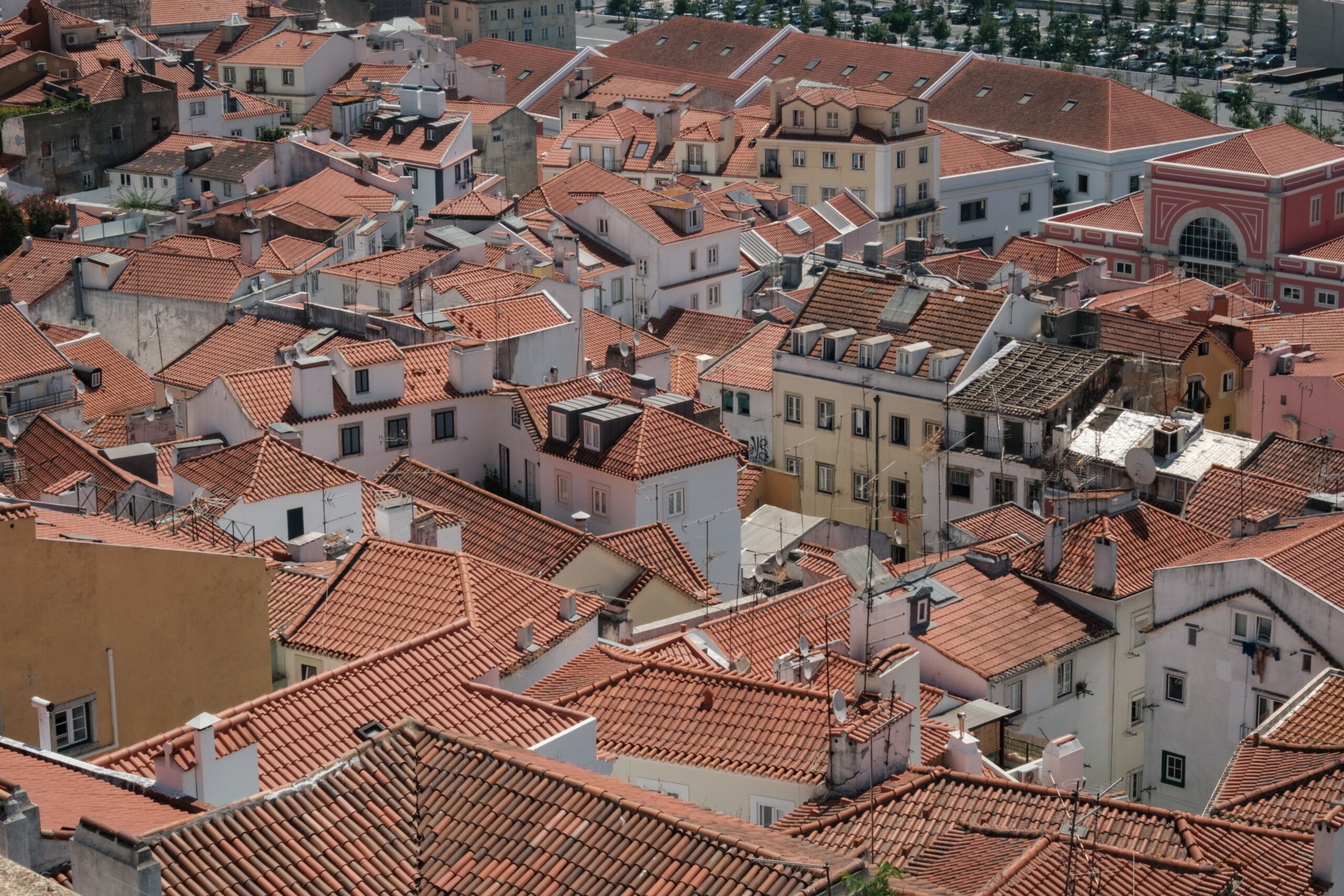 Aerial view of red tiled rooftops in Lisbon showcasing traditional Portuguese architecture