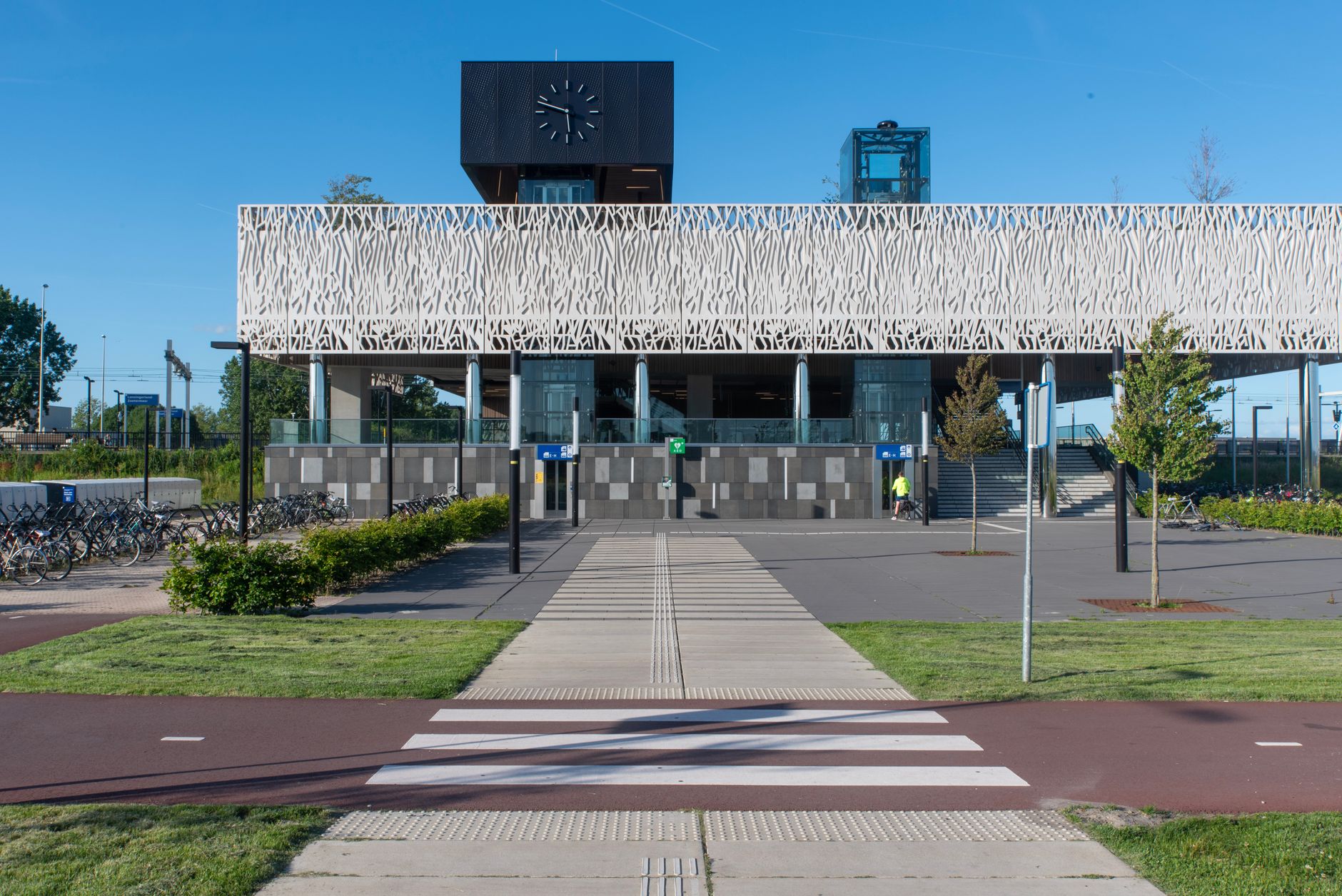 Modern Dutch train station exterior on a sunny summer day in the Netherlands