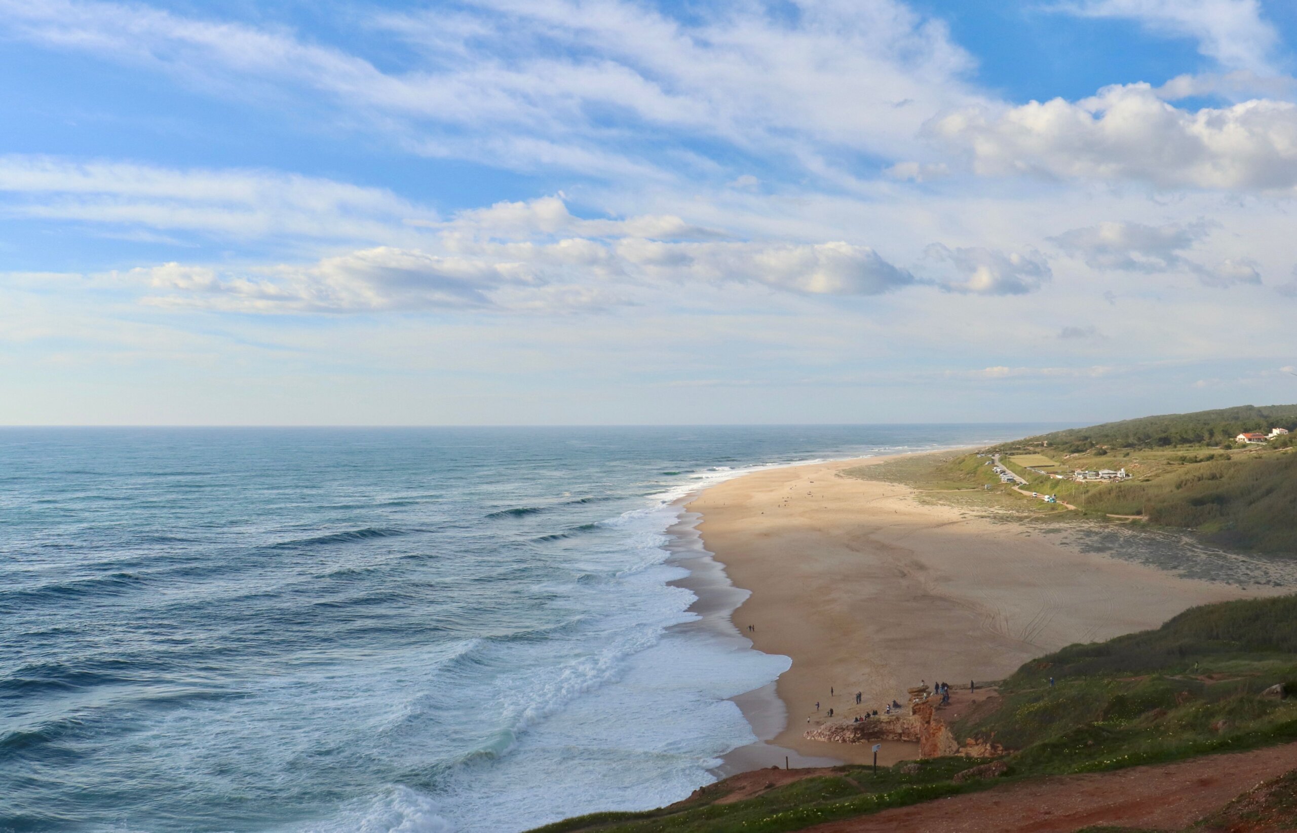 Sandy Atlantic beach near Lisbon, Portugal — the stretch toward Beach 19 Costa da Caparica