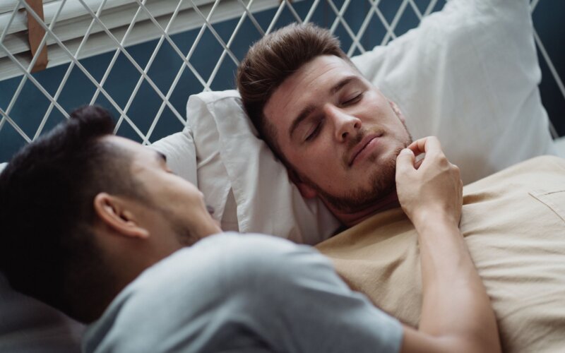 A loving couple sharing a tender moment in the bedroom