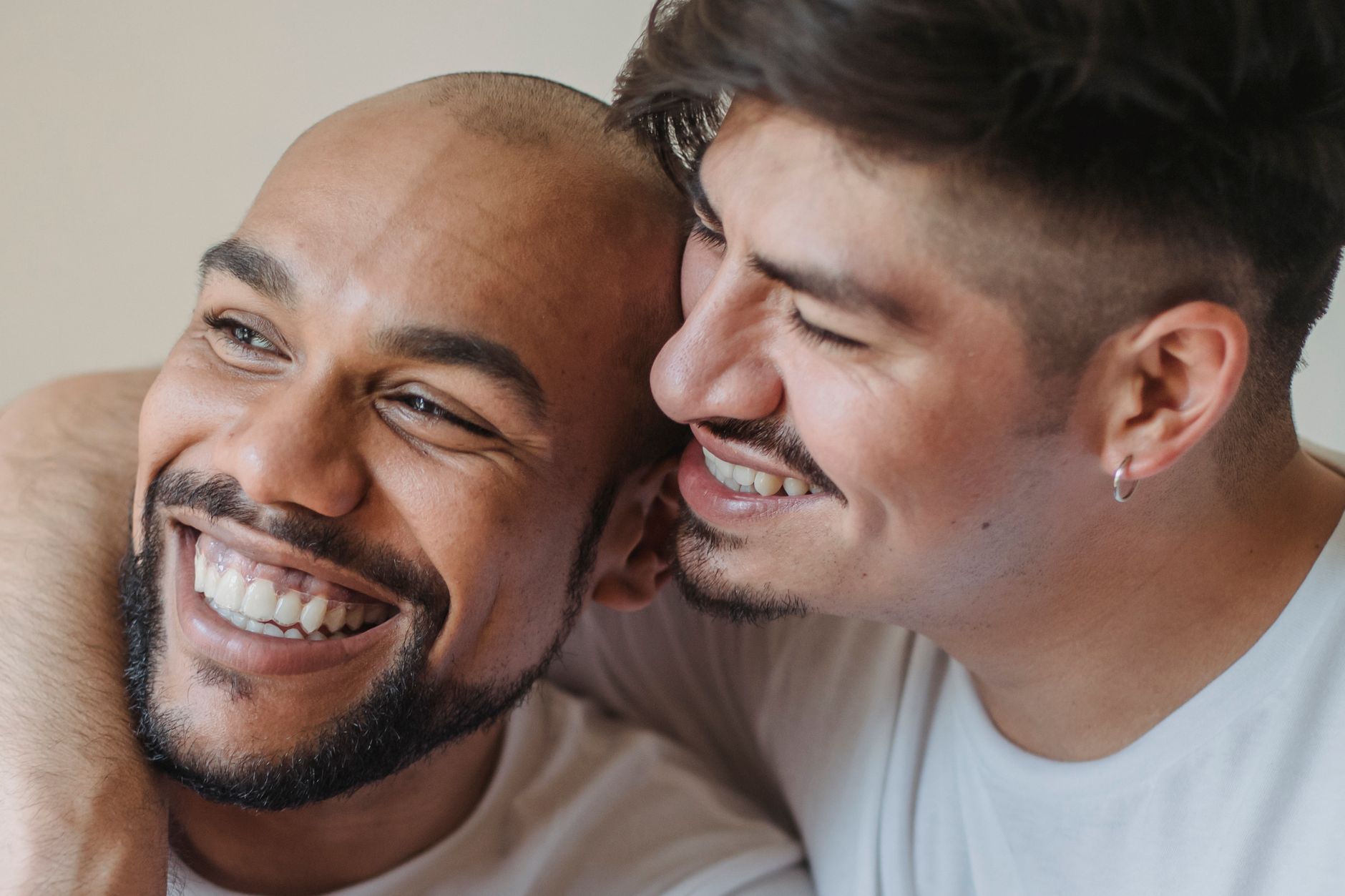 Close-up of two men embracing, a genuine moment of connection