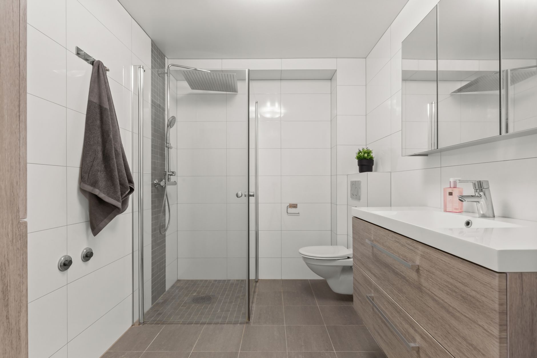 Sleek, modern bathroom with glass shower and minimalist decor
