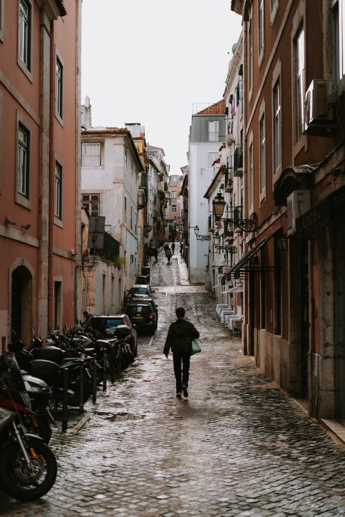 Lisbon Bairro Alto cobblestone street at night