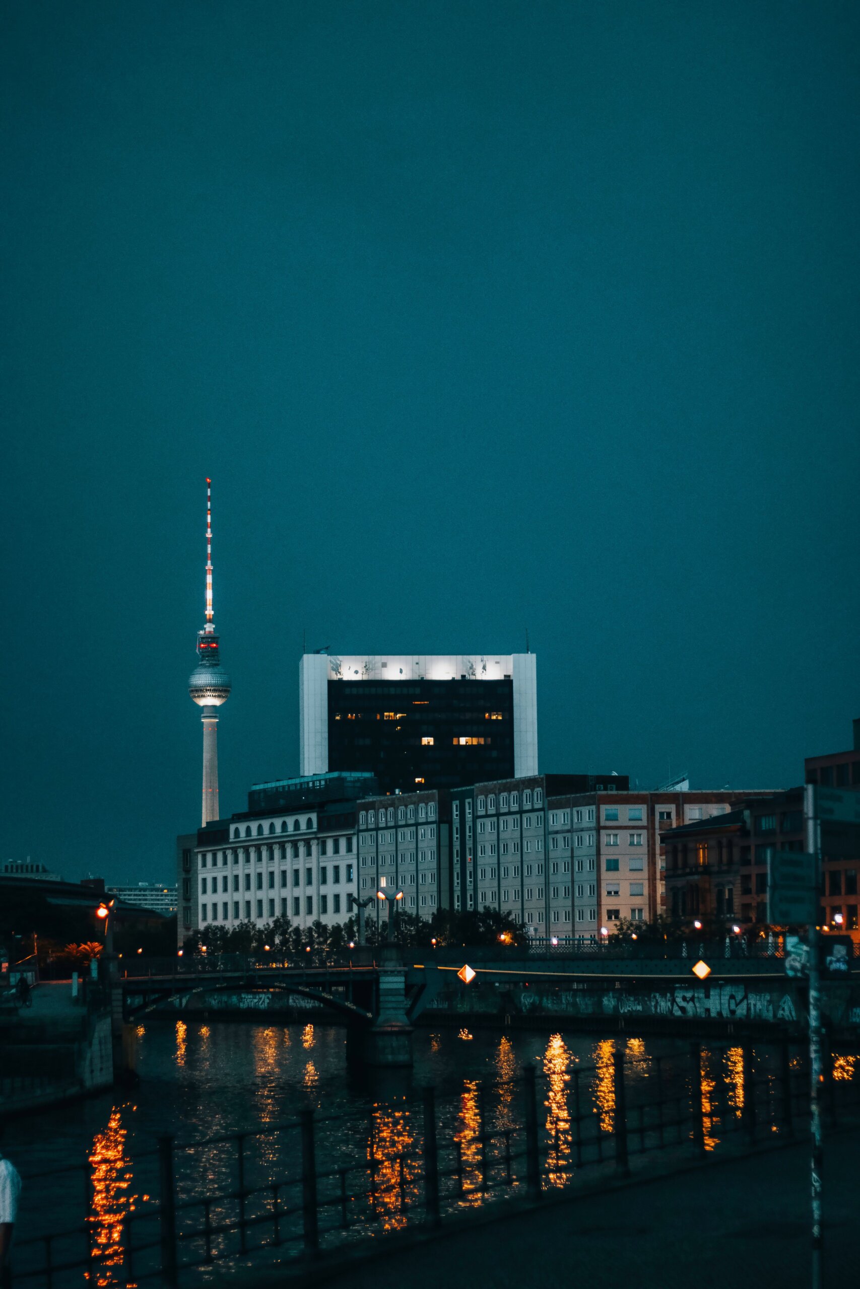 Berlin TV Tower reflected in Spree River at night