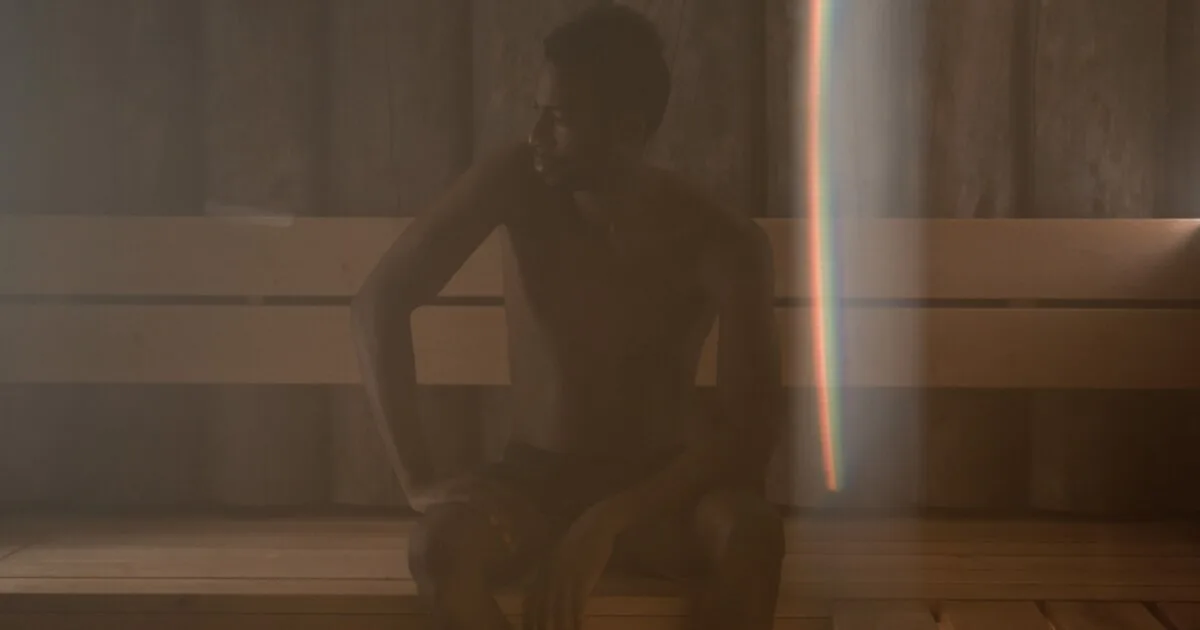 Man in wooden sauna room, gay sauna Berlin atmosphere