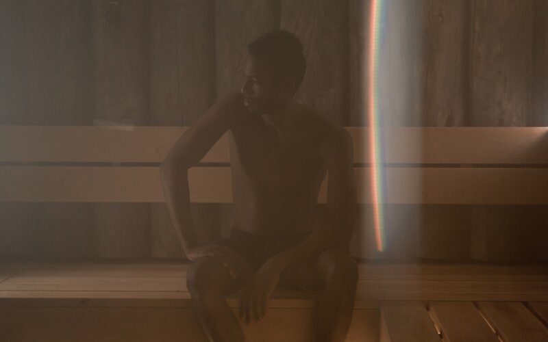 Man in wooden sauna room, gay sauna Berlin atmosphere